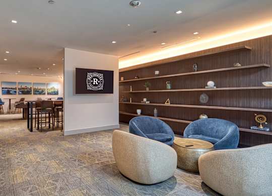 A room with a carpeted floor and a long wooden shelf at Residences at Richmond Trust in Richmond, Virginia, 23219