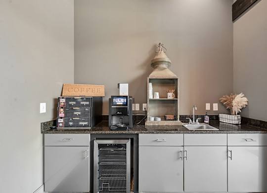 A coffee shop with a counter and a coffee machine.