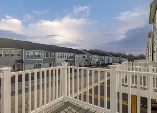 Building with balconies and a sidewalk at The Mark, Virginia