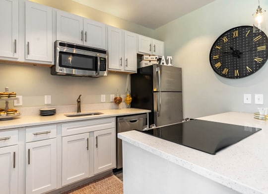Kitchen With White Cabinetry And Appliances at Litchfield Oaks Apartments, Pawleys Island