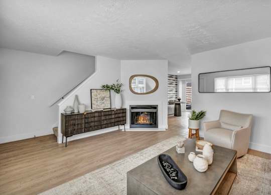 A living room with a fireplace and a couch.