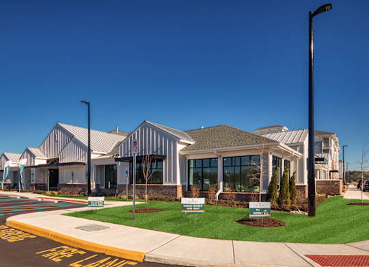 A building with a glass front and a sign that says "The Lane" in front of it.