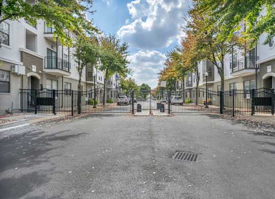 A street view of a residential area with apartment buildings on both sides.