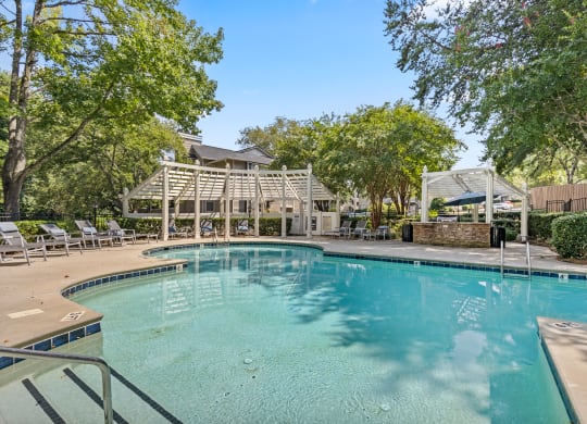 the swimming pool at the preserve at polo garden apartments