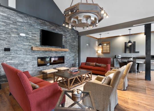 a living room with couches and chairs and a fireplace at Hayden Lofts, Dublin