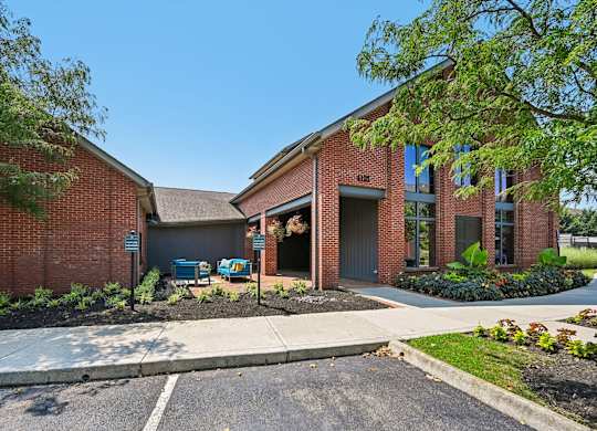 A red brick building with a garage door and a sign that says "Barnes & Noble".