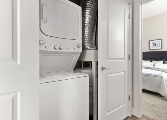 a white washer and dryer in a white laundry room at Hayden Lofts, Dublin, OH