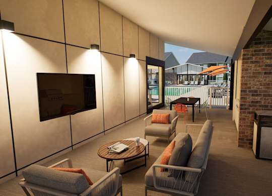 A patio with a couch, chairs, and a television.