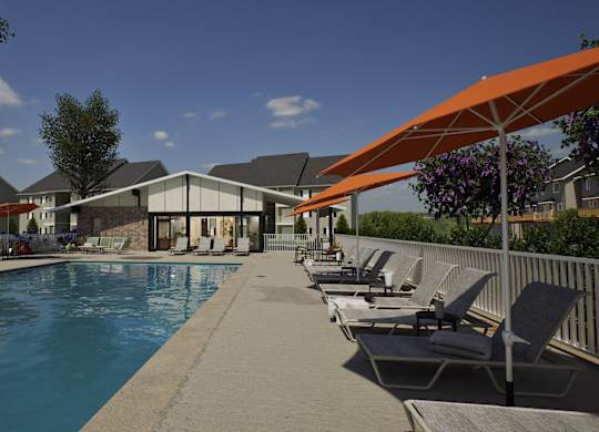 A pool with chairs and umbrellas is surrounded by buildings.