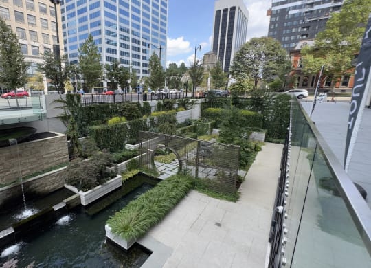 a park with a river in the middle of a city at Preston Centre, Columbus, Ohio