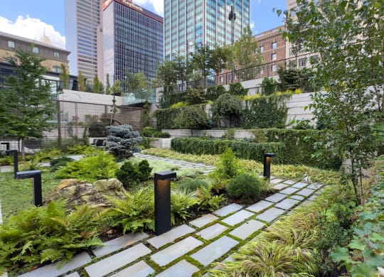 a garden with buildings in the background at Preston Centre, Columbus, OH, 43215
