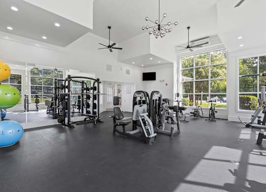 A spacious home gym with a variety of exercise equipment.
