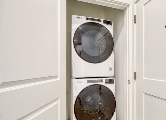 a small laundry room with a washer and dryer at Allure at Edinburgh, Virginia, 23322