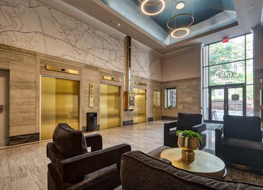 A large room with a blue ceiling and a map on the wall at Residences at Richmond Trust in Richmond, VA