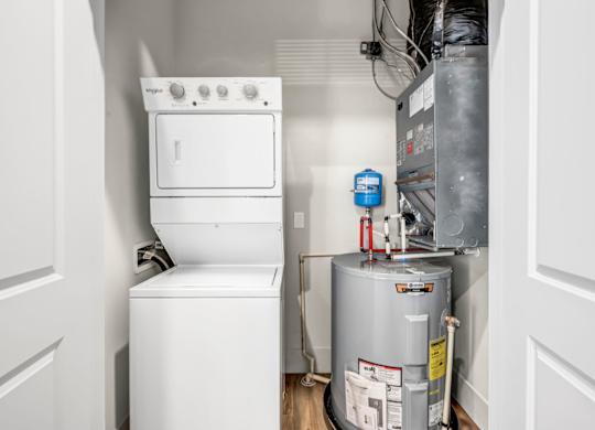 A white oven and dishwasher in a small kitchen.