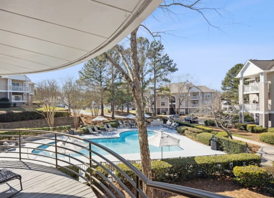 the preserve at ballantyne commons pool and patio area with apartment buildings