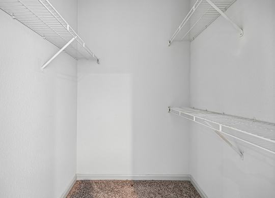 A white room with a carpeted floor and white walls.