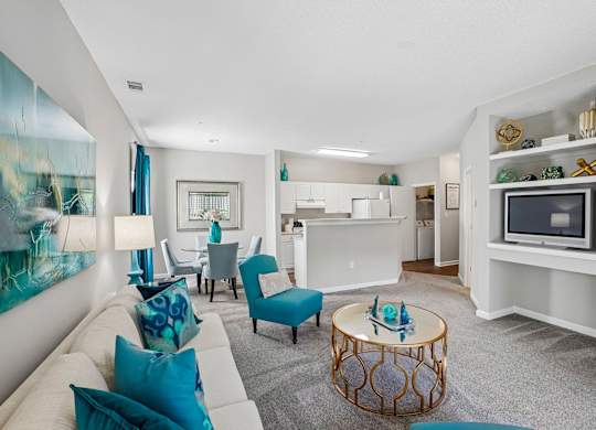 A living room with a white couch and a coffee table.