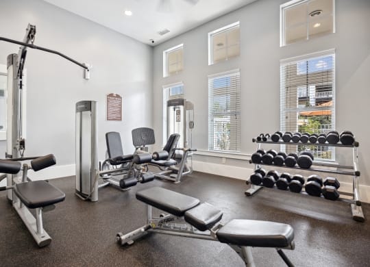 the gym with weights and equipment at the grove at cottonwood apartments