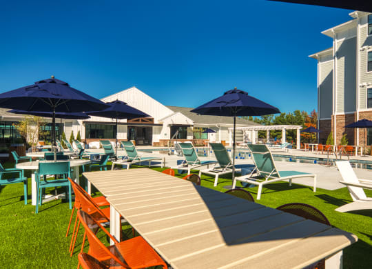 a large patio with tables and chairs and umbrellas