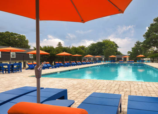 our apartments have a resort style pool and lounge chairs
