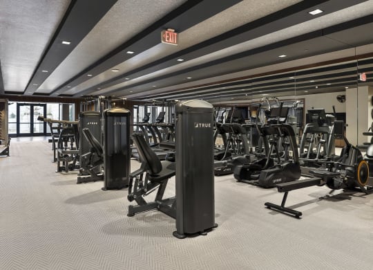 a gym with cardio machines and weights on the floorat Preston Centre, Columbus