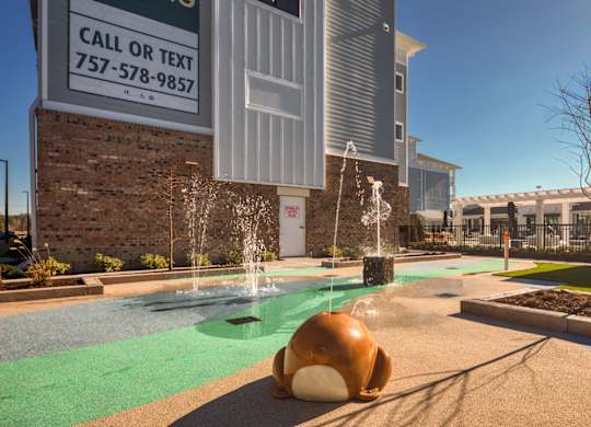 A playground with a slide and a ball.