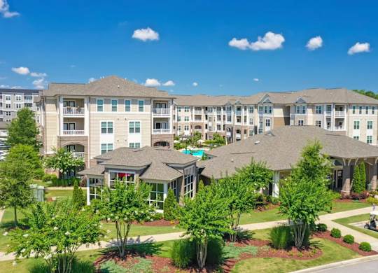 A large apartment complex with multiple buildings and landscaped gardens.