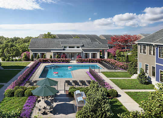 A large house with a pool in the backyard.