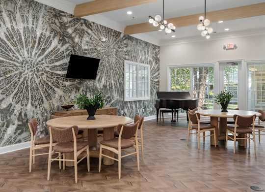 Multipurpose room with piano and seating at The Orchard, Dublin, OH, 43016