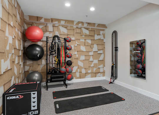 A gym room with a variety of exercise equipment. at The Orchard, Dublin, OH