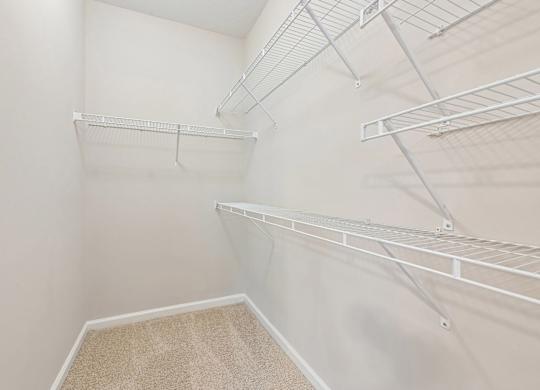 Empty white shelving unit in a room.