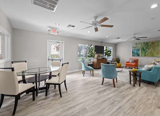 Dining area and living room with contemporary furniture at Peaks at Universal City Apartments, Universal City, TX 78148