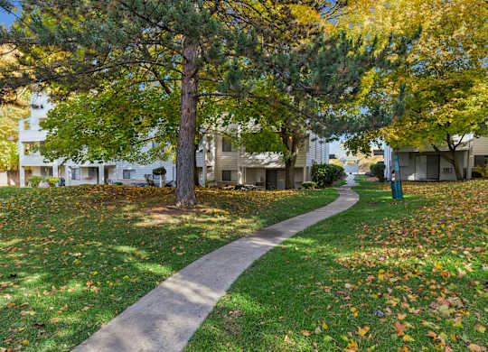 Pathway surrounded by lawn area at Peaks on Pines, Spokane Valley, WA