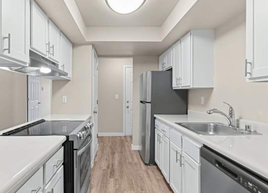 Kitchen with white cabinets at Peaks on Pines, Spokane Valley, WA, 99216