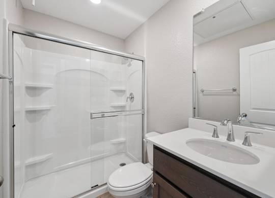 A White Bathroom with a Sink at Montessa Apartments, Vacaville, CA