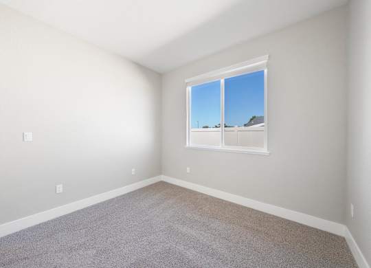A Room with a Window Showing a Blue Sky at Montessa Apartments, Vacaville