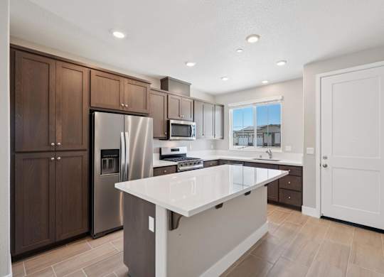 A Kitchen with a Cabinets at Montessa Apartments, California, 95687