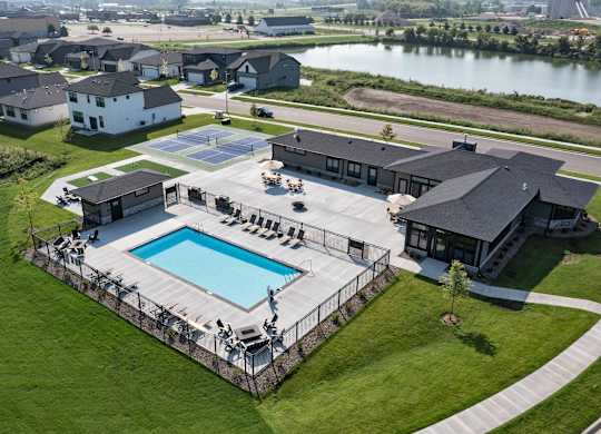 A large house with a pool in the backyard.