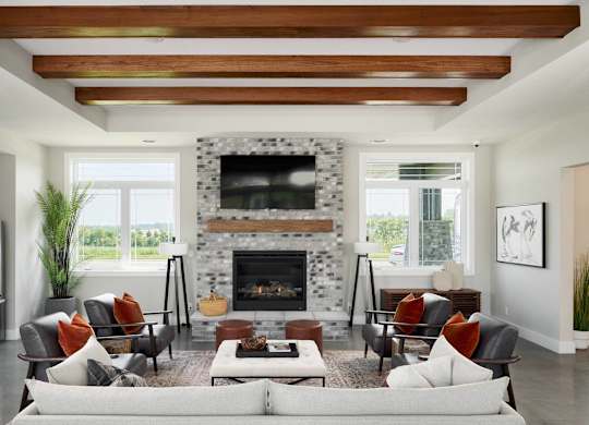A modern living room with a fireplace and a couch.