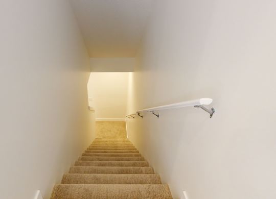 A staircase with a light at the top.
