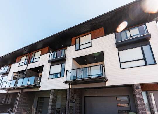 A modern building with balconies and windows.