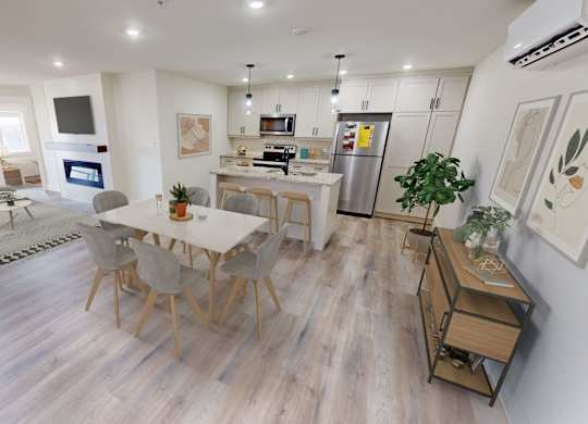A modern open plan living and kitchen area with a dining table and chairs.
