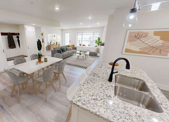 A modern kitchen with a dining table and chairs.