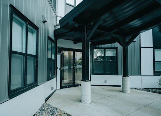 A modern building with a covered walkway.