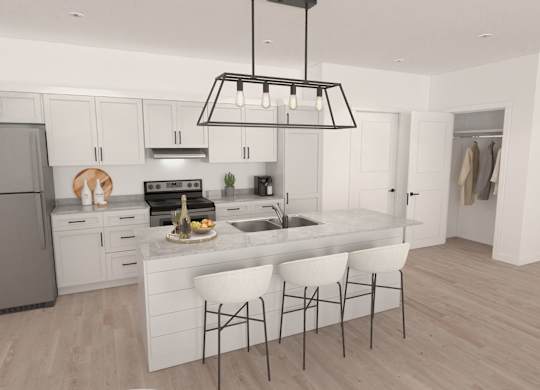 A modern kitchen with a large island and white cabinets.