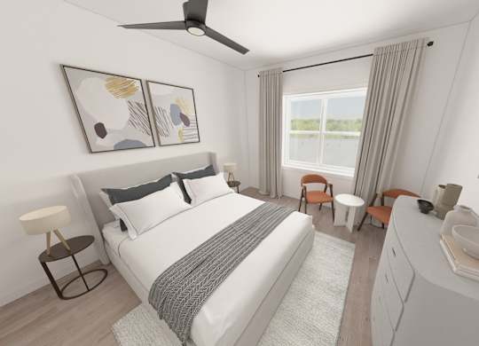 A bedroom with a large bed, a ceiling fan, and a window with curtains.