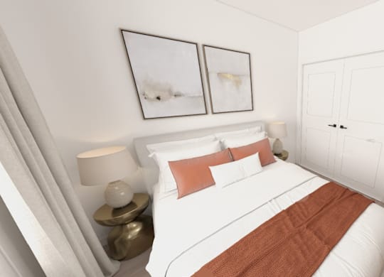A bedroom with a white bed and a brown blanket.