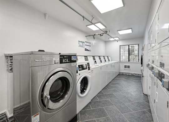 A row of washing machines in a laundromat.