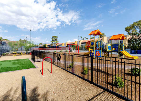 A playground with a slide, swings, and a climbing frame.